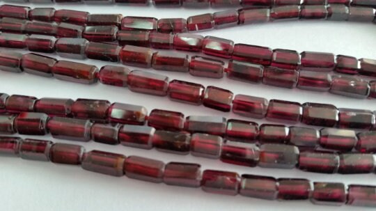 Garnet faceted Tube shape in 4x7mm , Length of strand is 14 Inch