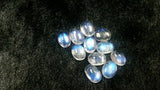 5X7MM Rainbow Moonstone smooth Oval cabs ,pack of 5 pcs , transparent and blue fire quality , grade AAAA