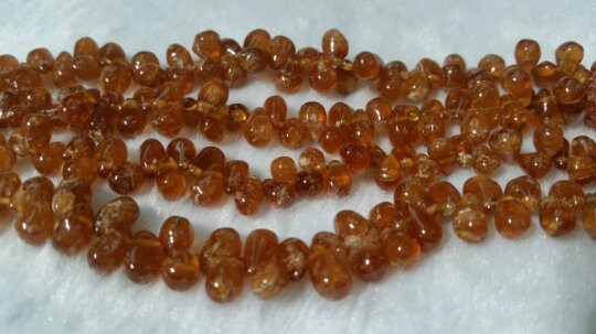 Hessonite Smooth Drop Shape , Size of beads 5X9MM , medium brown shade