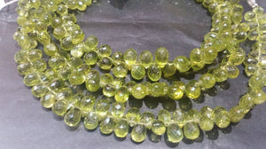 Peridot faceted drop beads 6x9 mm, length of strand 8 Inch