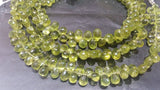 Peridot faceted drop beads 6x9 mm, length of strand 8 Inch