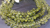 Peridot faceted drop beads 6x9 mm, length of strand 8 Inch