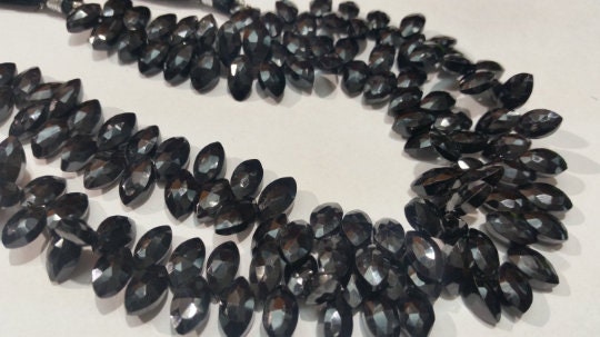 Markis faceted Black Spinel good Quality briolette , Size of Markis shape 6x11MM . Length of strand 10 Inch