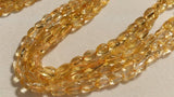 8X10 Citrine Oval shape , Length 15" straight drill beads. Natural Citrine shape.Origin Brazil