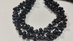 Drop faceted Black Spinel good Quality briolette , Size of Drop  shape 6x9MM . Length of strand 10 Inch