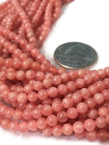 6mm Rhodochrosite Smooth Round shape. Genuine stone and perfect making with deep color . length 14 Inch . Quality AA