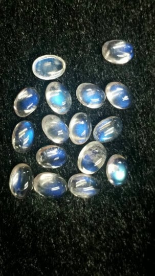 5X7MM Rainbow Moonstone smooth Oval cabs ,pack of 5 pcs , transparent and blue fire quality , grade AAAA