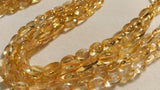 8X10 Citrine Oval shape , Length 15" straight drill beads. Natural Citrine shape.Origin Brazil