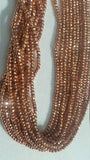 Pyrite Faceted Roundel 3mm Copper Coating , Length of strand 13.5"