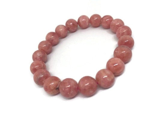 10mm Rhodochrosite Round Beads Top Quality , very good color & perfect Round . Bracelet of 7