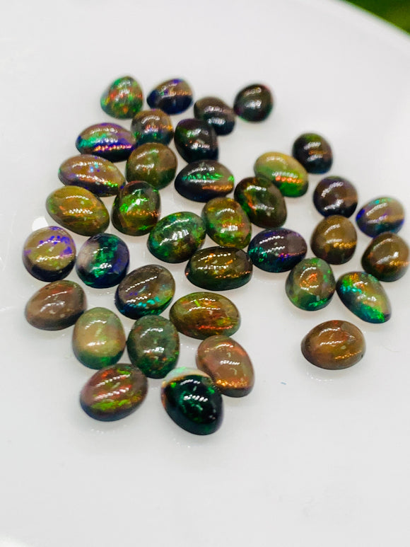 Black Opal Cabochon • 5x7 mm Size • pack of 4 Pcs • Code B6 - AAA Quality • Natural Opal Yellow Treated Color • Ethiopian Opal  Cabochon