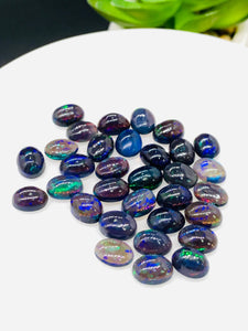 Black Opal Cabochon • 6x8 mm Size • Pack of 4 Pcs • Code B10 - AAA Quality • Natural Opal Dark Blue Treated Color • Ethiopian Opal Cabochon