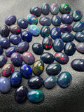 Black Opal Cabochon • 7x9 mm Size • Pack of 2 Pcs • Code B12 - AAAA Quality • Natural Opal Treated Color • Ethiopian Opal Cabs