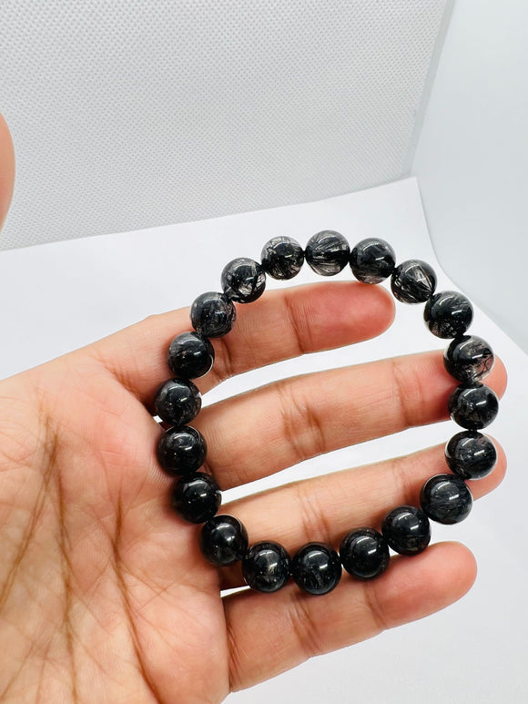 Black Rutile Bracelet 10 mm Code #B1  • 25.6 gm Weight • AAAA Quality • 7.5 Inch Length • Natural Rutilated Quartz  • Rutile Bracelet