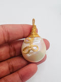 Freshwater Pearl pendant with wire wrapping, Silver wire with Gold plating, good luster on pearl.