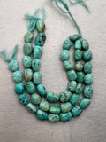 Turquoise nugget shape- 12X16 MM arpprox- genuine Turquoise tumble beads- Length 10", origin Peru.