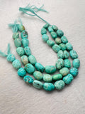 Turquoise nugget shape- 12X16 MM arpprox- genuine Turquoise tumble beads- Length 10", origin Peru.