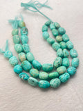Turquoise nugget shape- 12X16 MM arpprox- genuine Turquoise tumble beads- Length 10", origin Peru.