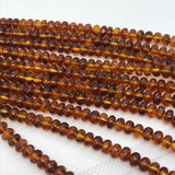 Amber 6MM Roundel beads , AAA Quality Natural Amber from Ukraine. Length 16 Inch . Perfect Round beads .