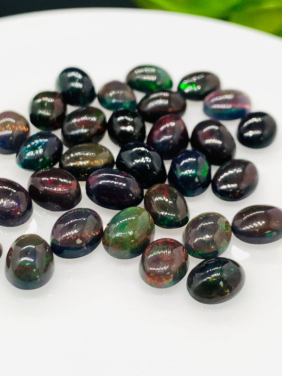 Black Opal Cabochon • 6x8 mm Size • Pack of 4 Pcs • Code B11 - AAA Quality • Natural Opal Treated Color • Ethiopian Opal  Cabochon