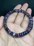 Sugilite roundel 8MM bracelet, stretch cord bracelet, length 7.5”, genuine sugilite, not dyed or treated. 100% genuine