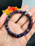 Sugilite roundel 8MM bracelet, stretch cord bracelet, length 7.5”, genuine sugilite, not dyed or treated. 100% genuine