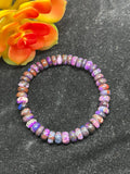 Sugilite roundel 8MM bracelet, stretch cord bracelet, length 7.5”, genuine sugilite, not dyed or treated. 100% genuine