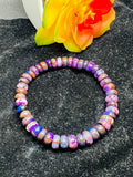 Sugilite roundel 8MM bracelet, stretch cord bracelet, length 7.5”, genuine sugilite, not dyed or treated. 100% genuine